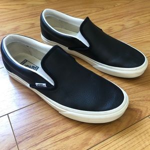 Vans Slip Ons | Black Leather & White Detailing